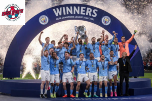 Manchester City players celebrating with a trophy