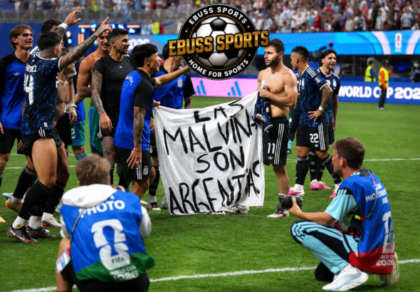 Argentina Falklands banner displayed by players wearing dark blue away jerseys after the World Cup semi-final
